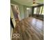 Bedroom featuring new wood floors and lots of natural light at 7835 Caswell St, Indianapolis, IN 46259