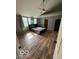Bedroom featuring wood floors, fan, and natural light at 7835 Caswell St, Indianapolis, IN 46259