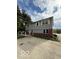 Two-story home with gray siding, large windows, and a brick foundation at 7835 Caswell St, Indianapolis, IN 46259