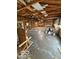 Huge garage with a high ceiling, built-in shelving, and a concrete floor offers versatile storage solutions at 7835 Caswell St, Indianapolis, IN 46259