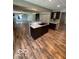 Open kitchen featuring an island sink and views of the living room at 7835 Caswell St, Indianapolis, IN 46259