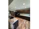 Modern kitchen with dark wood cabinets, stainless appliances and a grey countertop at 7835 Caswell St, Indianapolis, IN 46259