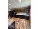 Kitchen with stainless steel appliances, dark wood cabinets, and a grey countertop at 7835 Caswell St, Indianapolis, IN 46259