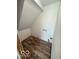 Unfinished upstairs laundry room with hardwood floors, plain white walls and in-wall water access at 7835 Caswell St, Indianapolis, IN 46259