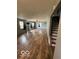 Spacious living room featuring hardwood flooring and abundant natural light throughout at 7835 Caswell St, Indianapolis, IN 46259