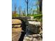 A retaining wall along a paved walking path that is both functional and aesthetically pleasing at 811 J Mccool Way, Greenwood, IN 46142