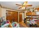 Cozy room with wood trim and a ceiling fan; good storage options at 8111 Timberwood Dr, Plainfield, IN 46168