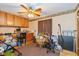 Neutral room with wallpaper, desk, and storage; ceiling fan at 8111 Timberwood Dr, Plainfield, IN 46168