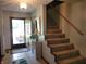 Bright foyer with staircase, tiled floor, and decorative accents at 8111 Timberwood Dr, Plainfield, IN 46168