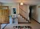 Inviting foyer featuring a staircase, white cabinet and stylish decor at 8111 Timberwood Dr, Plainfield, IN 46168