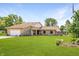 Beautiful stone home with an attached two-car garage and expansive front yard at 8111 Timberwood Dr, Plainfield, IN 46168
