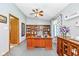 Cozy home office with built in shelving and a ceiling fan at 8111 Timberwood Dr, Plainfield, IN 46168