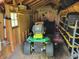 Interior view of shed with lawn equipment, including a riding mower at 8111 Timberwood Dr, Plainfield, IN 46168