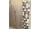 A wall tile design featuring geometric patterned tiles in neutral colors, creating visual interest and texture at 8111 Timberwood Dr, Plainfield, IN 46168
