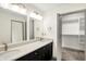 Spacious bathroom with double sinks, granite countertops, and a walk-in closet at 815 Stewart Rd, Anderson, IN 46012