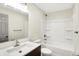 This bathroom features a shower over tub, stylish vanity with a sink, and neutral decor at 815 Stewart Rd, Anderson, IN 46012