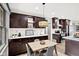 Modern dining area featuring a pendant light and dark wood cabinetry at 815 Stewart Rd, Anderson, IN 46012