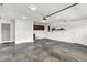 This well-lit garage features a service door, utility sink, and abundant storage options at 815 Stewart Rd, Anderson, IN 46012