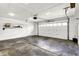 Spacious garage with ample lighting, white door, and plenty of room for storage at 815 Stewart Rd, Anderson, IN 46012