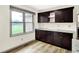 Well-lit kitchenette area features storage and outside view at 815 Stewart Rd, Anderson, IN 46012