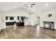 Open-concept living room with fireplace and view of the modern kitchen at 815 Stewart Rd, Anderson, IN 46012