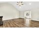 Spacious living room with vaulted ceiling, wood floors, and natural light at 815 Stewart Rd, Anderson, IN 46012