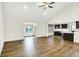 Bright living room with wood floors and view of the kitchen area at 815 Stewart Rd, Anderson, IN 46012
