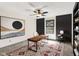 Home office with modern decor, a stylish rug, and a ceiling fan at 815 Stewart Rd, Anderson, IN 46012