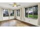 A sunroom filled with natural light from multiple windows, perfect for relaxation at 815 Stewart Rd, Anderson, IN 46012