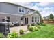Patio area with outdoor furniture, lush landscaping, and a fenced in yard at 8704 New Heritage Dr, Indianapolis, IN 46239