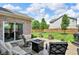 Lovely backyard with a patio, complete with comfortable seating and a cozy fire pit feature at 8704 New Heritage Dr, Indianapolis, IN 46239