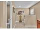 Neutral bathroom with a tiled floor, a glass shower, a white toilet, and decorative objects at 8704 New Heritage Dr, Indianapolis, IN 46239