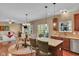 Open-concept dining area seamlessly connecting the kitchen, dining, and living spaces at 8704 New Heritage Dr, Indianapolis, IN 46239
