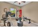 Home gym featuring exercise bike, punching bag, and free weights at 8704 New Heritage Dr, Indianapolis, IN 46239