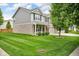 Well-maintained home with a spacious front yard, manicured lawn, and mature tree at 8704 New Heritage Dr, Indianapolis, IN 46239