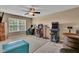 Spacious game room with arcade games, comfortable seating, and a beverage cooler for ultimate entertainment at 8704 New Heritage Dr, Indianapolis, IN 46239