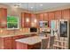 Well-appointed kitchen featuring stainless steel appliances, stylish lighting, and granite counters at 8704 New Heritage Dr, Indianapolis, IN 46239