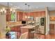 Modern kitchen boasts stainless steel appliances, a central island, and open layout at 8704 New Heritage Dr, Indianapolis, IN 46239