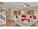 Cozy living room featuring a plush sectional sofa and hardwood floors at 8704 New Heritage Dr, Indianapolis, IN 46239