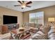 Inviting living room with a leather sofa, a TV, and a rustic-style coffee table with storage at 8704 New Heritage Dr, Indianapolis, IN 46239