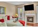 Inviting living room features a fireplace, large screen television, and comfortable seating at 8704 New Heritage Dr, Indianapolis, IN 46239