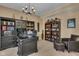 Spacious office with custom built-ins, desk, leather chair and ottoman. Perfect for working from home! at 8704 New Heritage Dr, Indianapolis, IN 46239