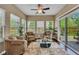 Cozy sunroom with abundant natural light, comfortable seating, and access to the outdoors at 8704 New Heritage Dr, Indianapolis, IN 46239