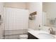 Bathroom with decorative basket, shower curtain, sink, and fixtures at 8732 Wicklow Way, Brownsburg, IN 46112