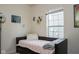 Bedroom with a large window, neutral decor, and natural light at 8732 Wicklow Way, Brownsburg, IN 46112