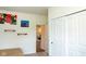 Bedroom with a view into the living room. Neutral carpet and walls at 8732 Wicklow Way, Brownsburg, IN 46112
