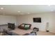 Second floor bonus room with carpeting, a TV, and a gray sofa at 8732 Wicklow Way, Brownsburg, IN 46112
