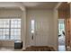 Bright foyer with natural light, hardwood floors, white door and trim, with views into other rooms at 8732 Wicklow Way, Brownsburg, IN 46112