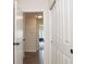 Hallway featuring hard wood floors and white doors leading to other rooms in the home at 8732 Wicklow Way, Brownsburg, IN 46112