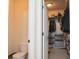 Spacious walk-in closet with ample storage space and shelving for organization, next to a half-bathroom at 8732 Wicklow Way, Brownsburg, IN 46112